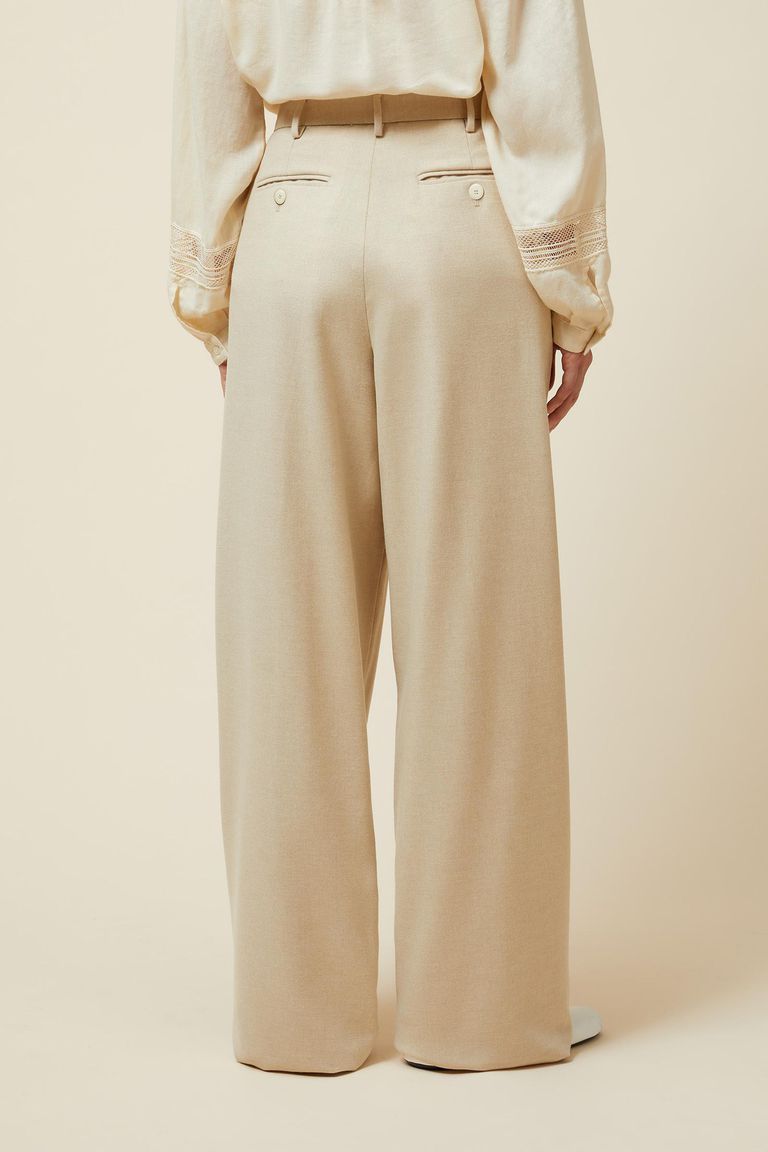 Trousers with slightly wide leg cut and pleats