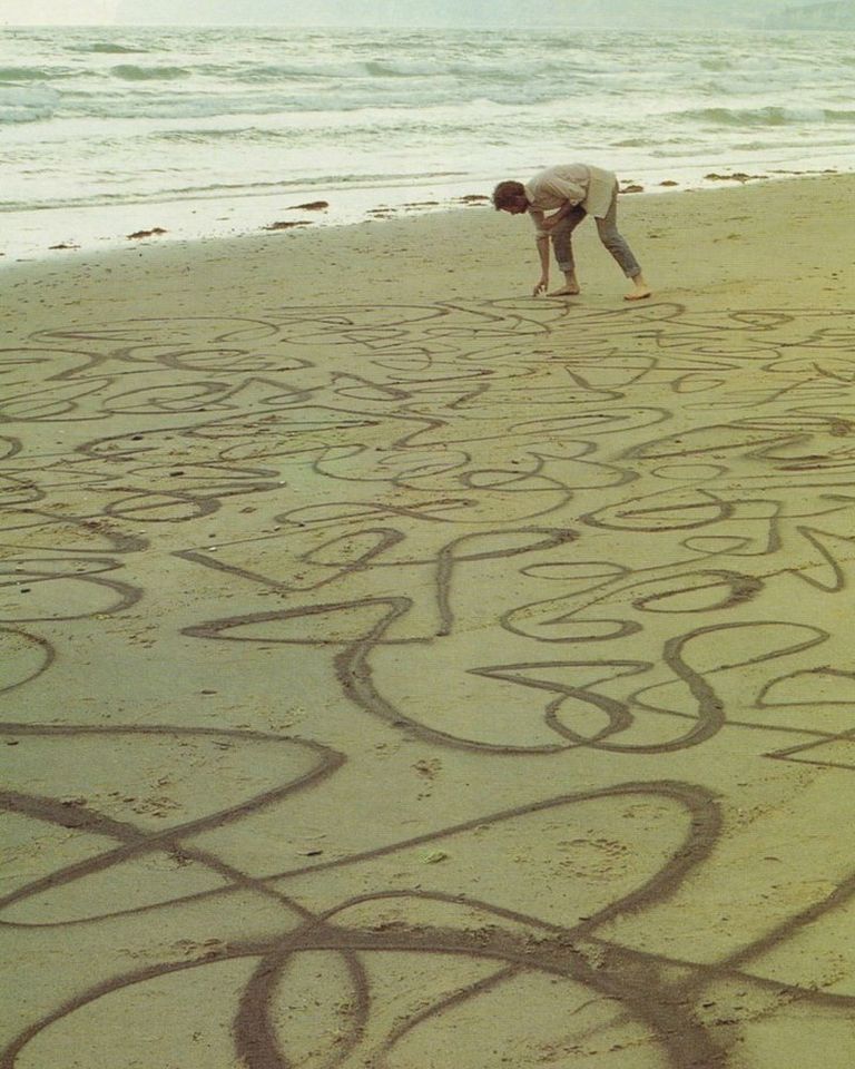 Andy Goldsworthy’s “Dark Dry Sand Drawing” captures the fragile dialogue between human gesture and the rhythms of nature.