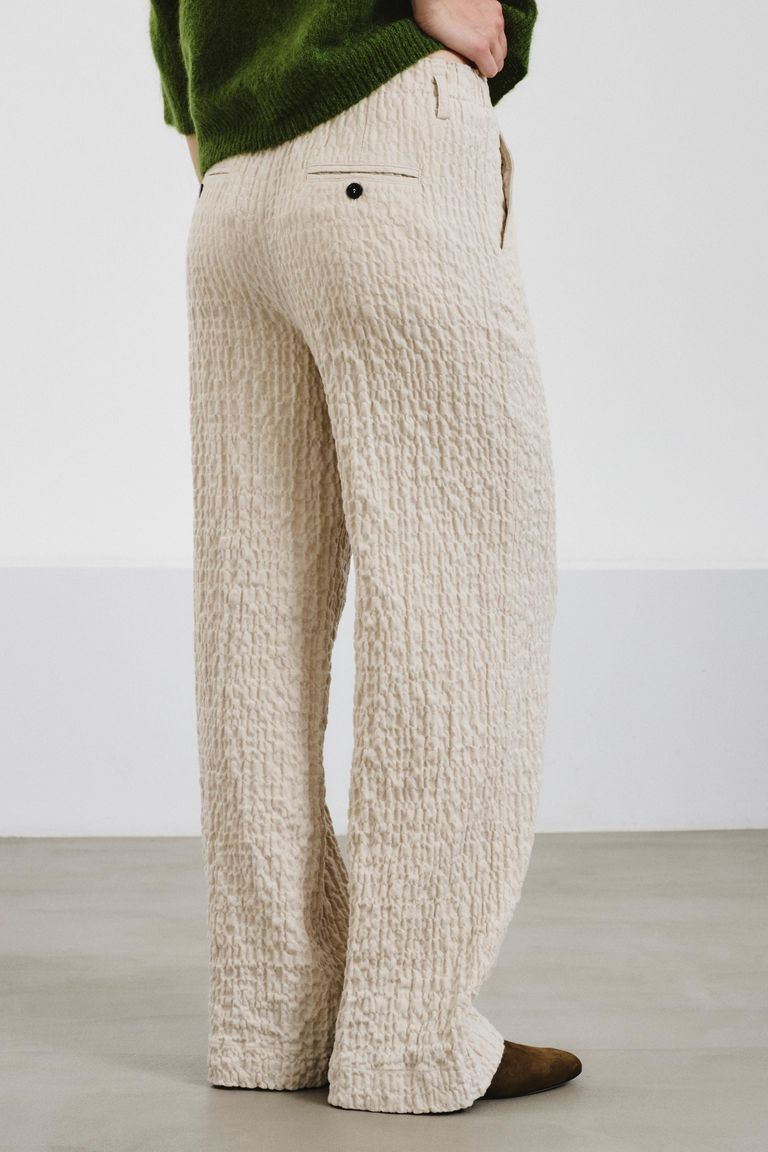 Trousers in embossed micro-herringbone cotton ivory